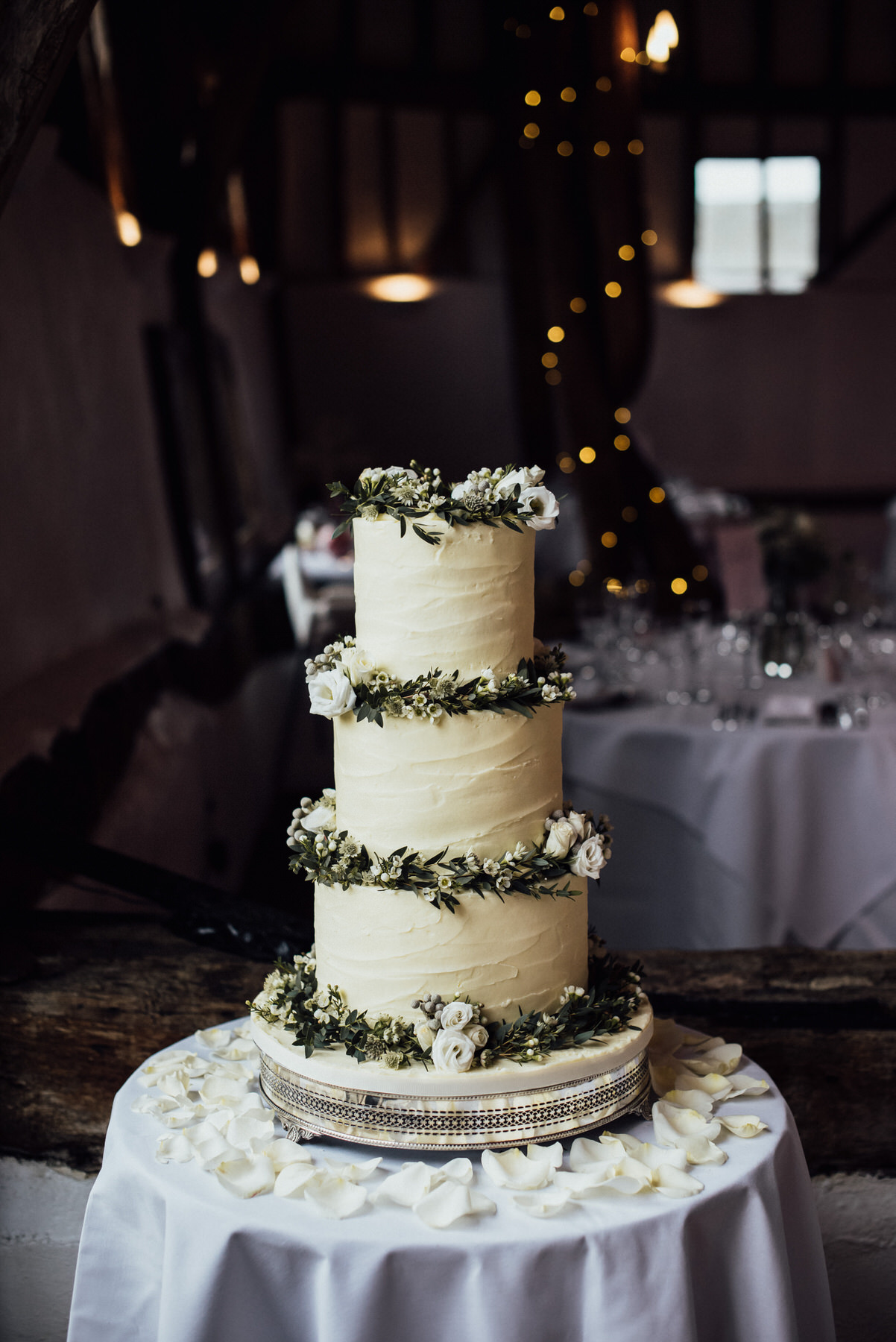 creative wedding photography, alternative wedding photographer, wedding cake, white wedding cake with foliage, smeetham hall barn