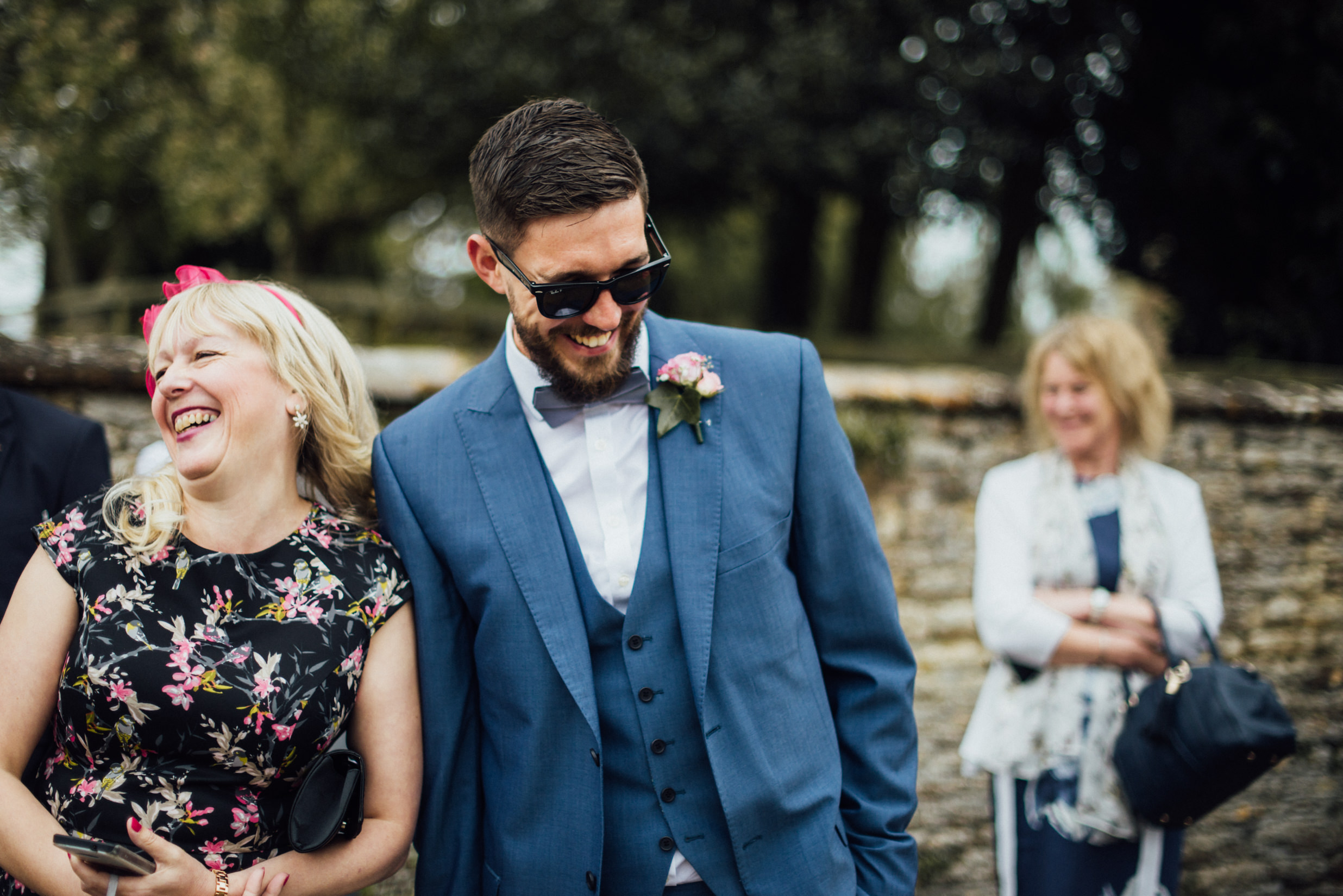groom laughing, cotswolds wedding photographer, alternative wedding photographer